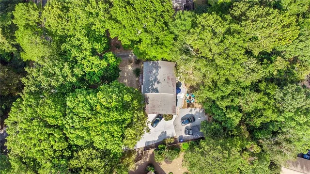 an aerial view of a house with a yard
