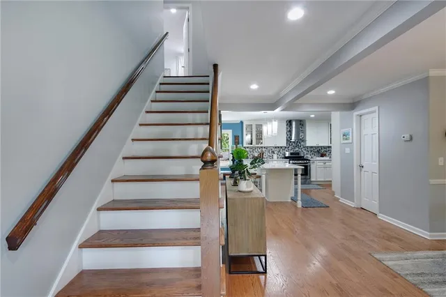 a view of kitchen with furniture and wooden floor