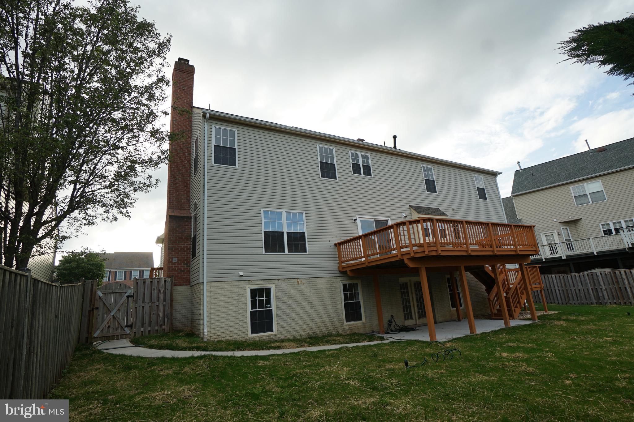 6311 Willowfield Way Springfield, VA 22150 - Photo 4 of 77 Rear with new sidewalk, refurbished deck and lawn