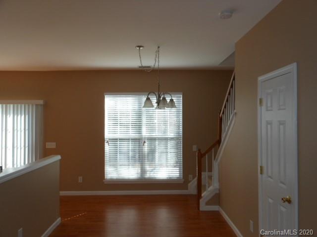14018 Dingess Road Charlotte, NC 28273 - Photo 2 of 14 a view of an empty room with a window