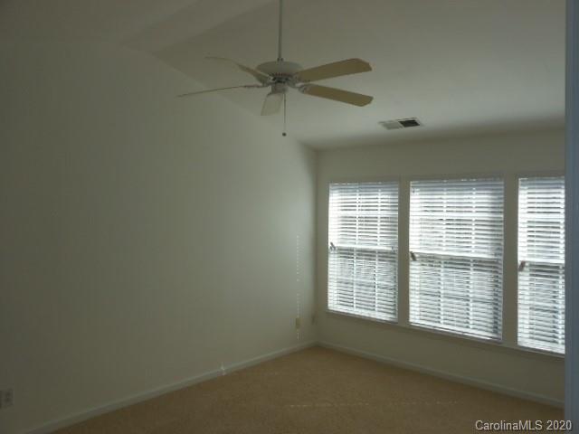 14018 Dingess Road Charlotte, NC 28273 - Photo 7 of 14 a view of an empty room with a window