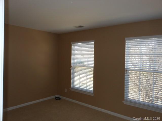 14018 Dingess Road Charlotte, NC 28273 - Photo 9 of 14 a view of an empty room with a window