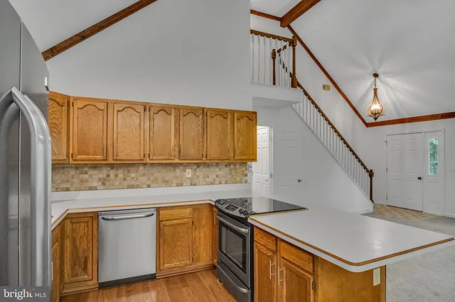 a kitchen with a stove and a refrigerator