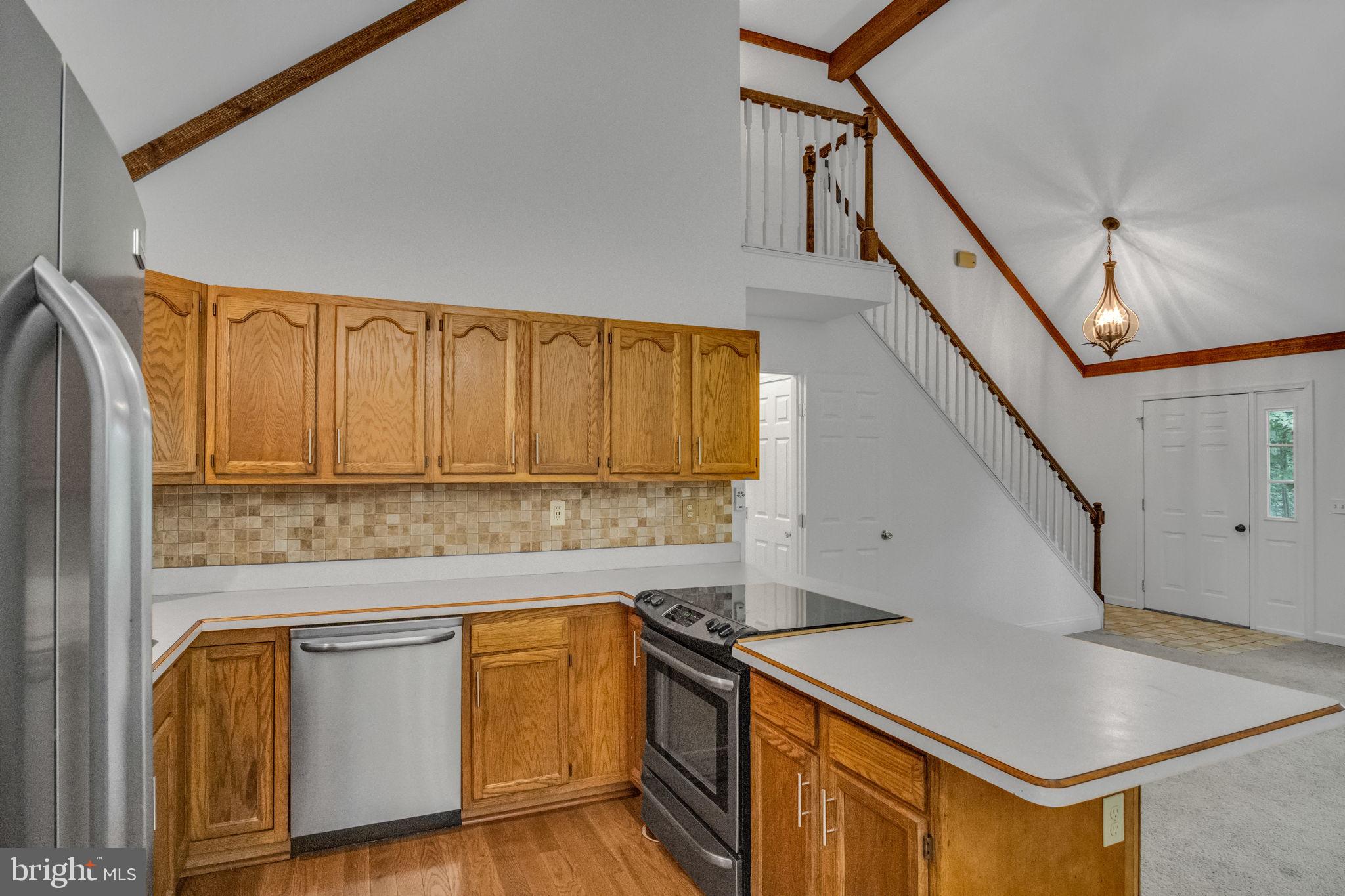 17 Dove Trail Fairfield, PA 17320 - Photo 12 of 43 a kitchen with stainless steel appliances granite countertop a sink a stove and a refrigerator