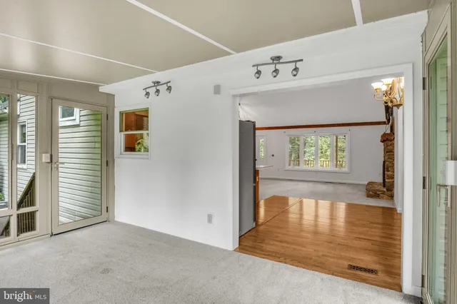 a bathroom with a granite countertop sink mirror vanity and toilet