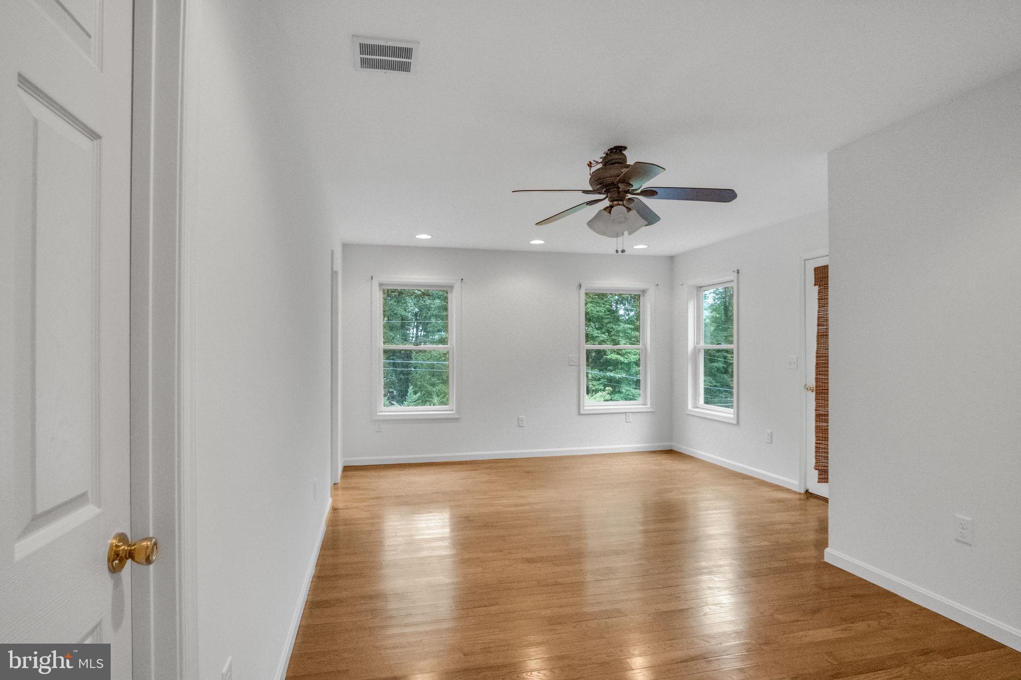 17 Dove Trail Fairfield, PA 17320 - Photo 25 of 43 an empty room with wooden floor and windows