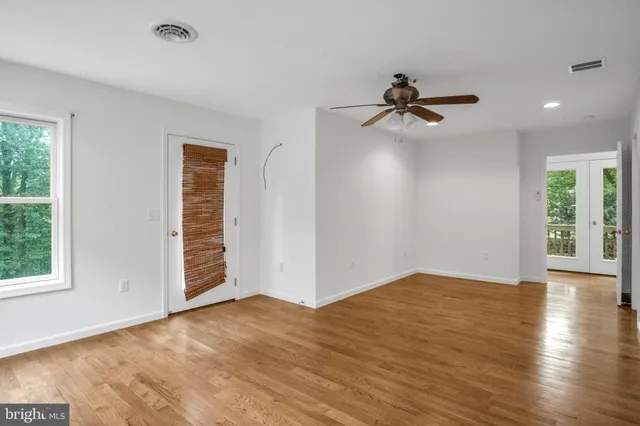 a bathroom with a toilet and shower