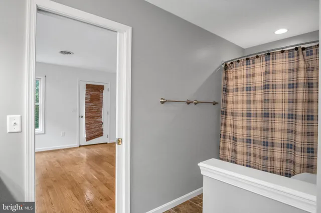 wooden floor in a hall with a window