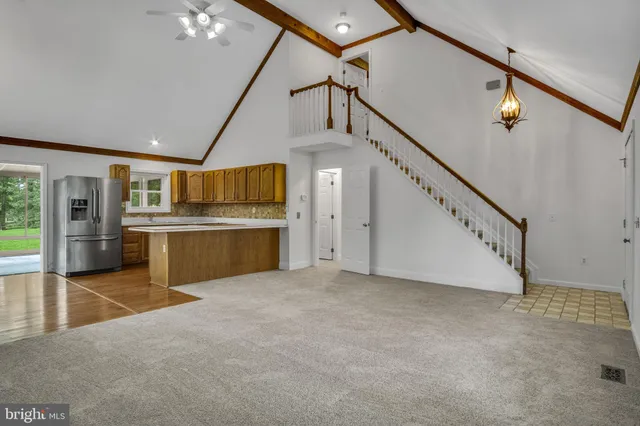 a view of a kitchen with furniture and a kitchen