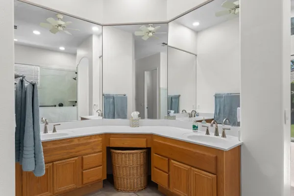 a bathroom with a tub sink and mirror