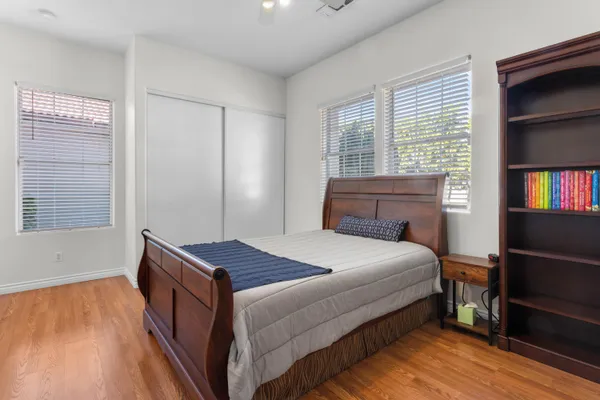 a bedroom with a bed and window