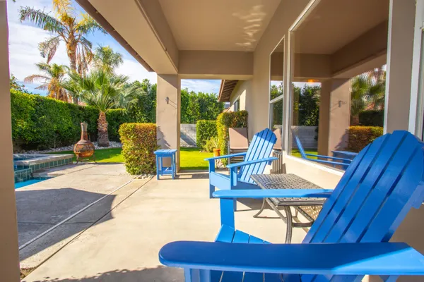 a view of a swimming pool with a patio