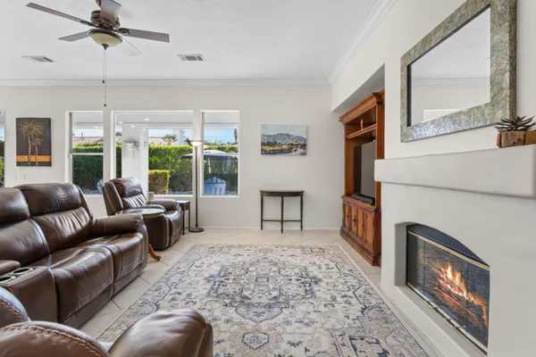 a living room with furniture and a fireplace