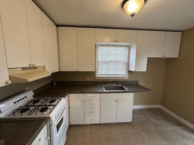 842 South Graham Street Memphis, TN 38111 - Photo 9 of 14 a kitchen with granite countertop a sink a stove and cabinets