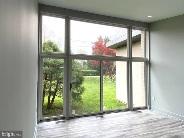 a kitchen with stainless steel appliances kitchen island granite countertop a refrigerator and a stove top oven