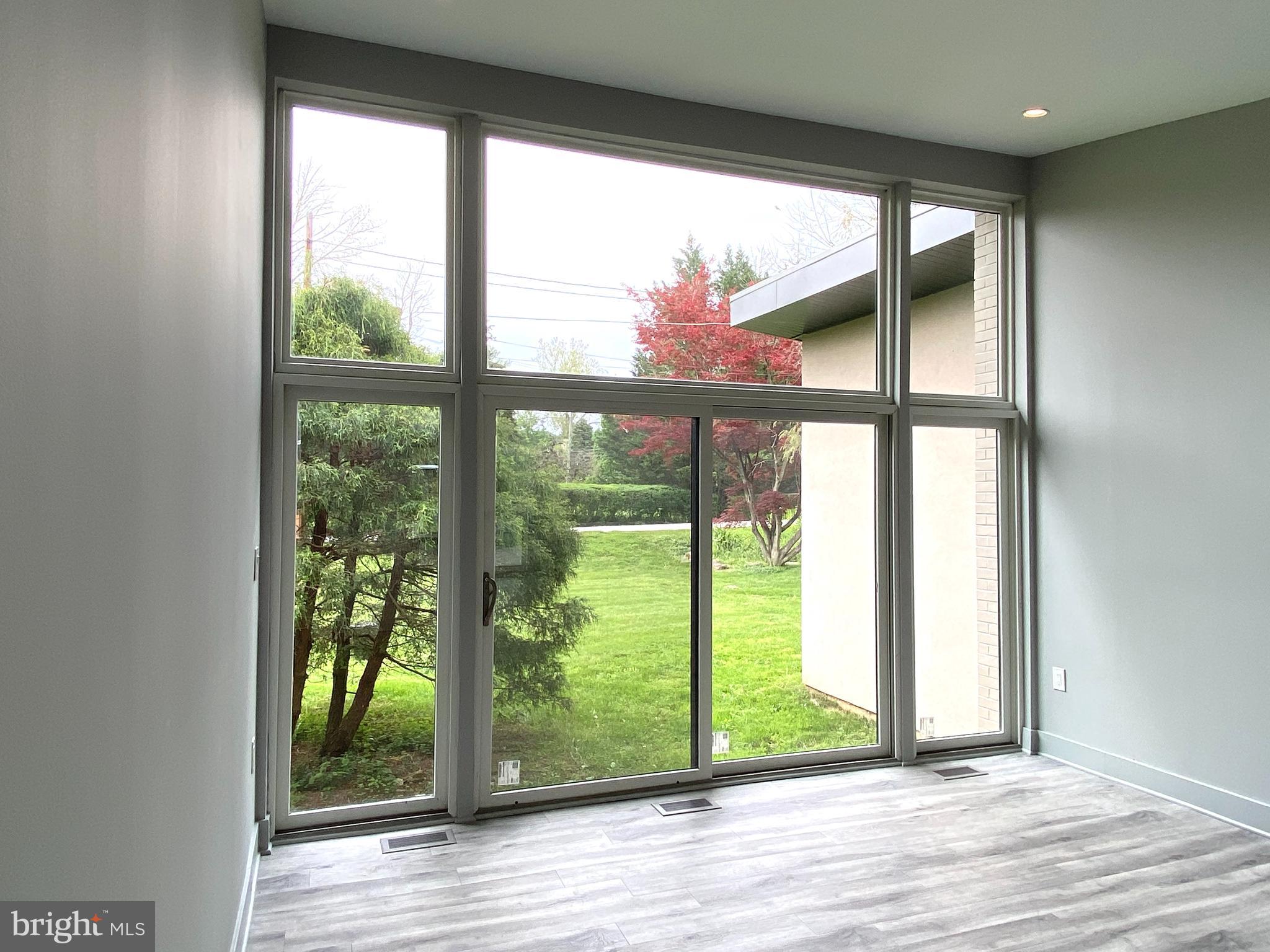 10530 Stevenson Road Stevenson, MD 21153 - Photo 24 of 98 a view of an empty room with wooden floor and a window