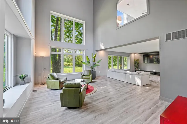 a bed sitting in a bedroom next to a cabinet