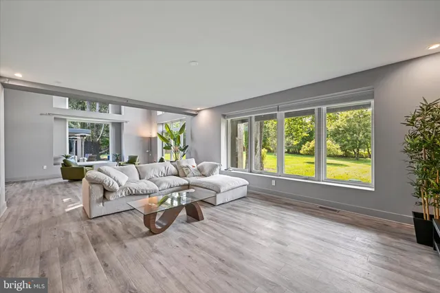 a view of empty room with closet and flat screen tv