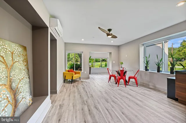 a living room with furniture and a window