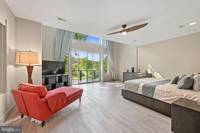 a bathroom with a granite countertop toilet sink and mirror