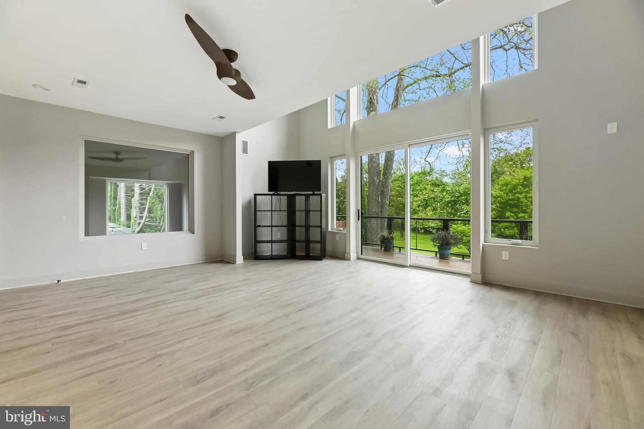 10530 Stevenson Road Stevenson, MD 21153 - Photo 51 of 98 a view of an empty room with a window and wooden floor