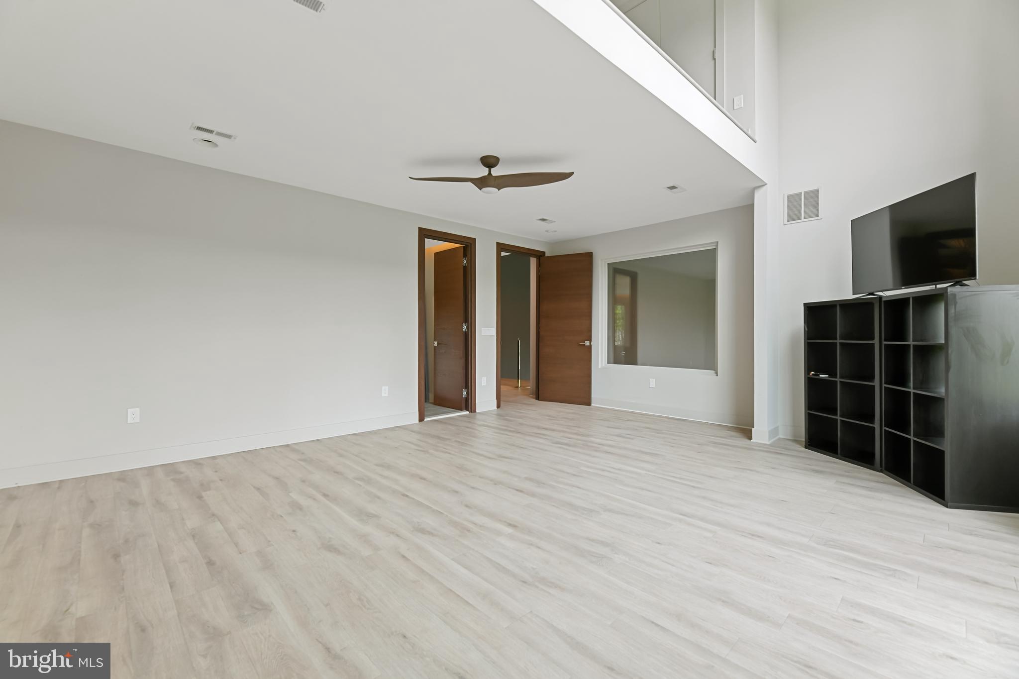 10530 Stevenson Road Stevenson, MD 21153 - Photo 52 of 98 a view of empty room with closet and flat screen tv