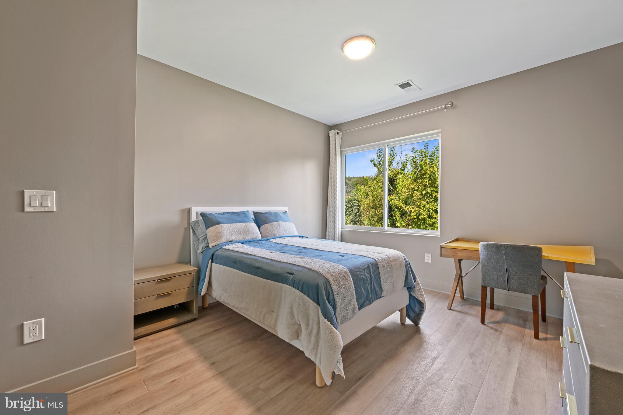 10530 Stevenson Road Stevenson, MD 21153 - Photo 63 of 98 a bed room with a bed and a chair