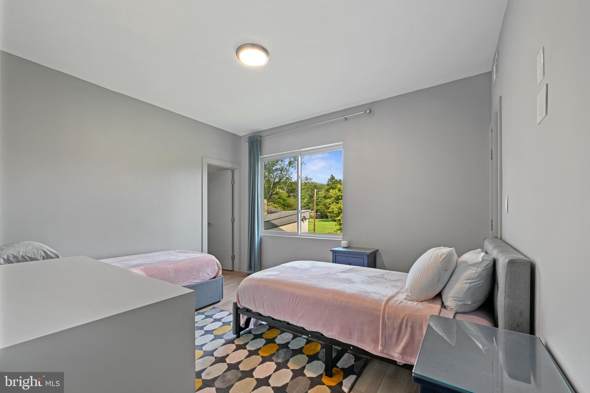 10530 Stevenson Road Stevenson, MD 21153 - Photo 64 of 98 a bedroom with a bed and wooden floor