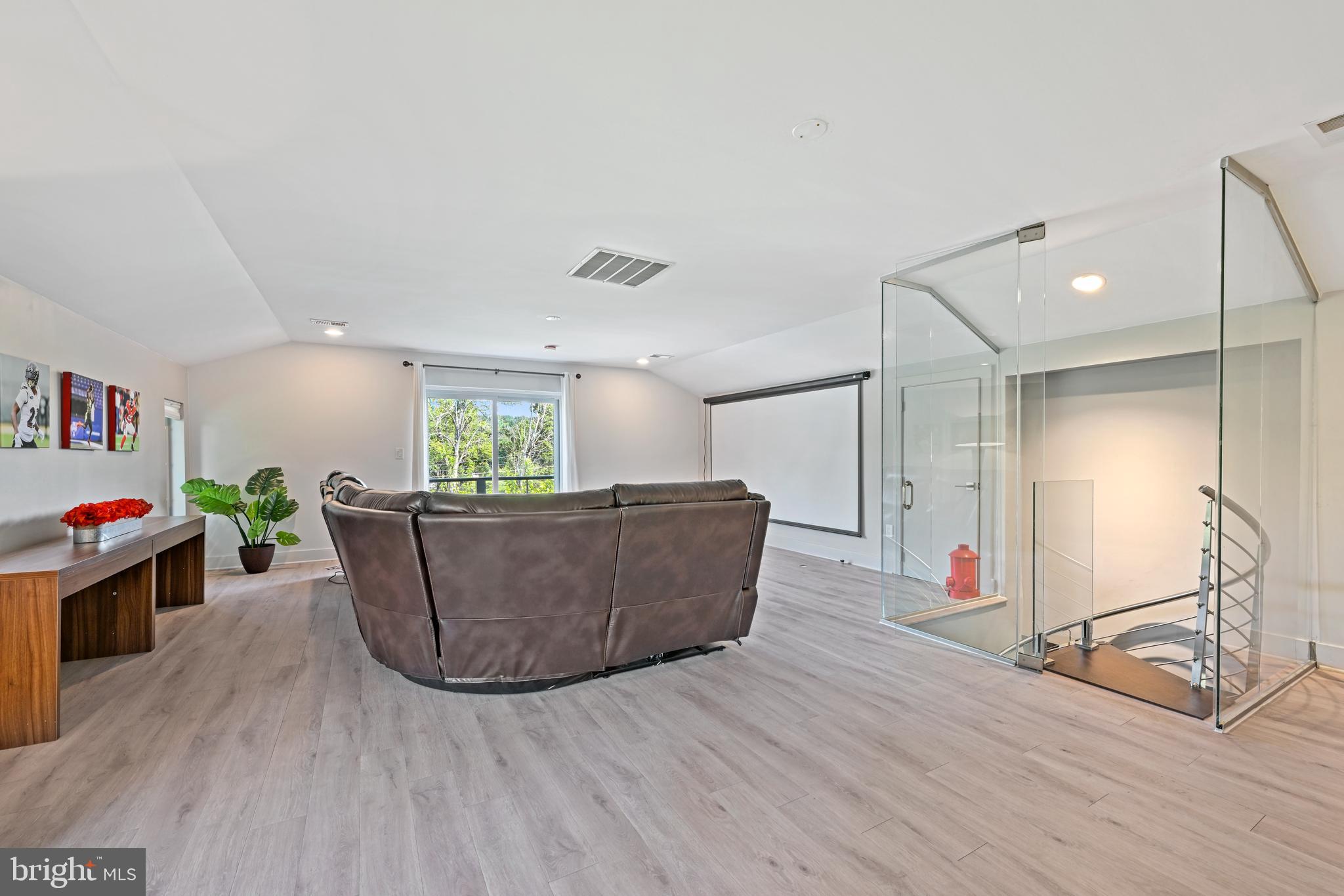 10530 Stevenson Road Stevenson, MD 21153 - Photo 67 of 98 a living room with furniture and a wooden floor