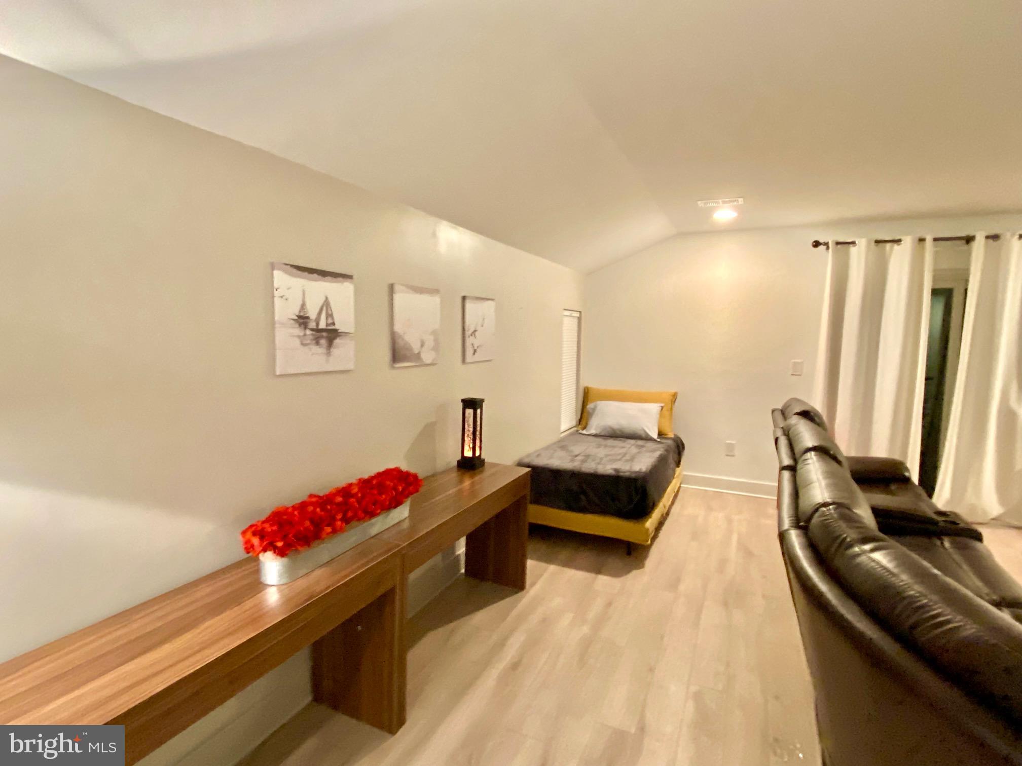 10530 Stevenson Road Stevenson, MD 21153 - Photo 68 of 98 3rd floor rec room - seating convertible to beds