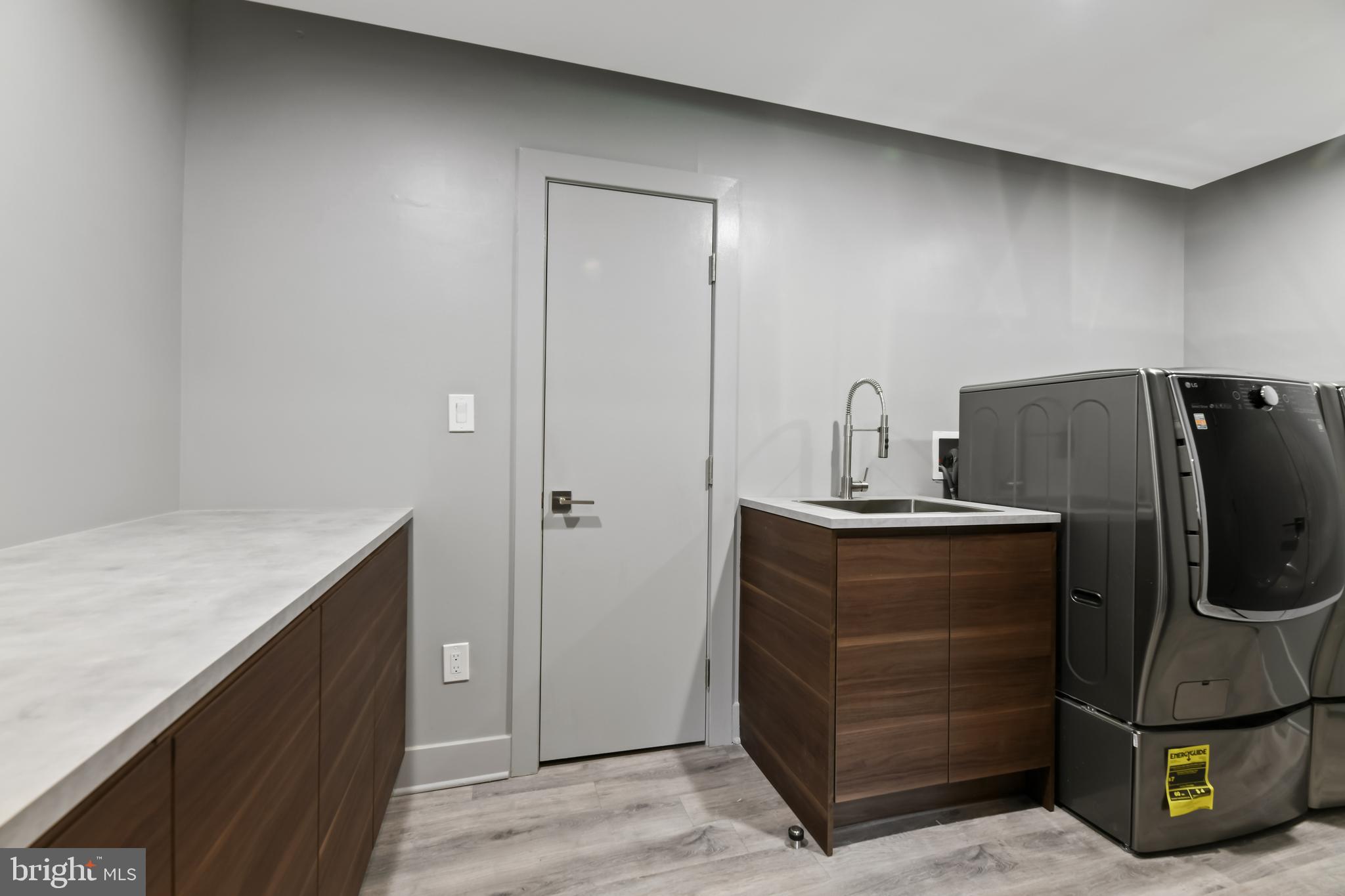 10530 Stevenson Road Stevenson, MD 21153 - Photo 76 of 98 Laundry room #1 with folding table and cabinet.