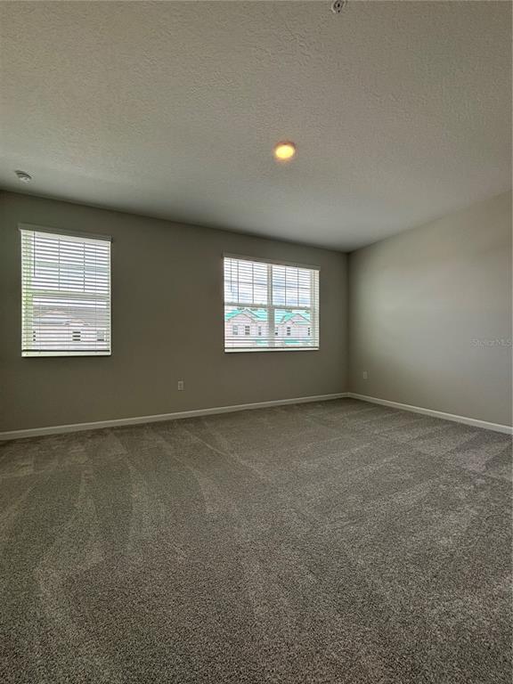 660 Pothos Street Apopka, FL 32703 - Photo 19 of 32 a view of an empty room with a window