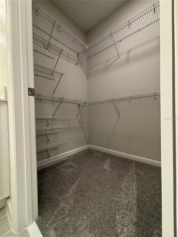 660 Pothos Street Apopka, FL 32703 - Photo 22 of 32 a view of a room with racks on the wall