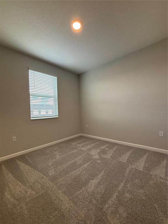660 Pothos Street Apopka, FL 32703 - Photo 25 of 32 an empty room with a window