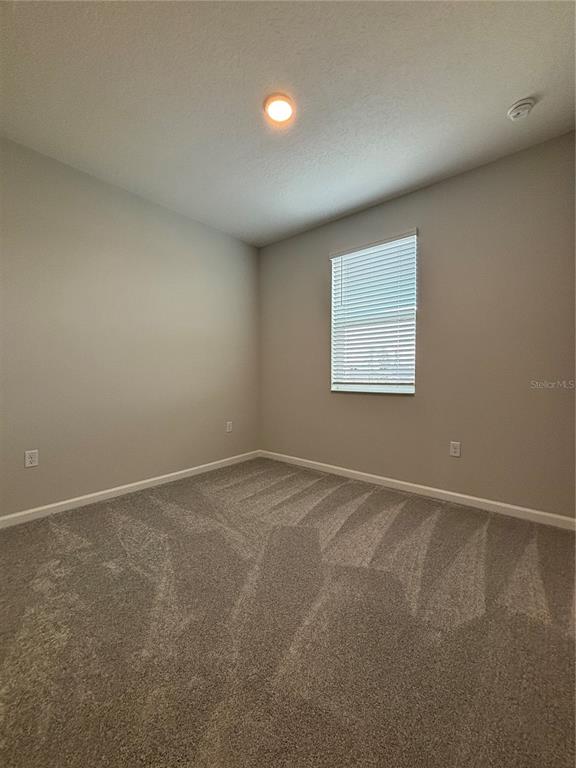 660 Pothos Street Apopka, FL 32703 - Photo 26 of 32 an empty room with a window