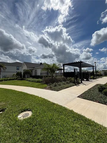 a view of a swimming pool with a yard