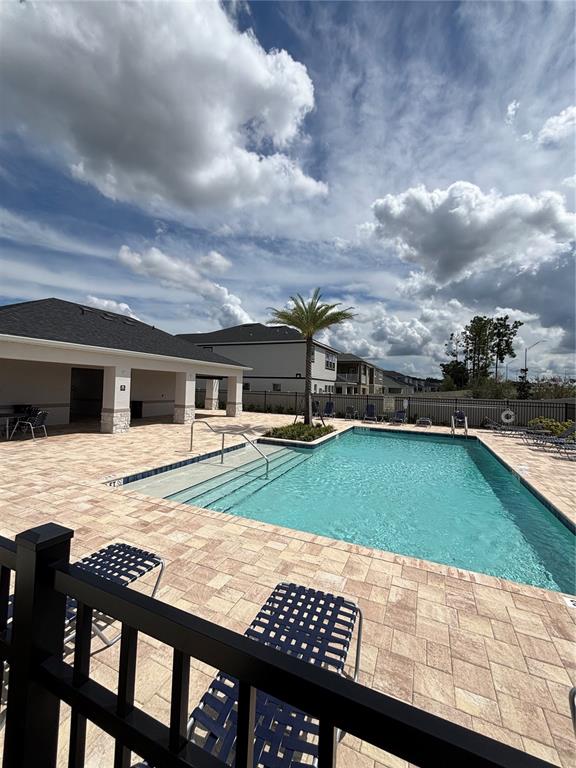 660 Pothos Street Apopka, FL 32703 - Photo 31 of 32 a view of a swimming pool with a yard