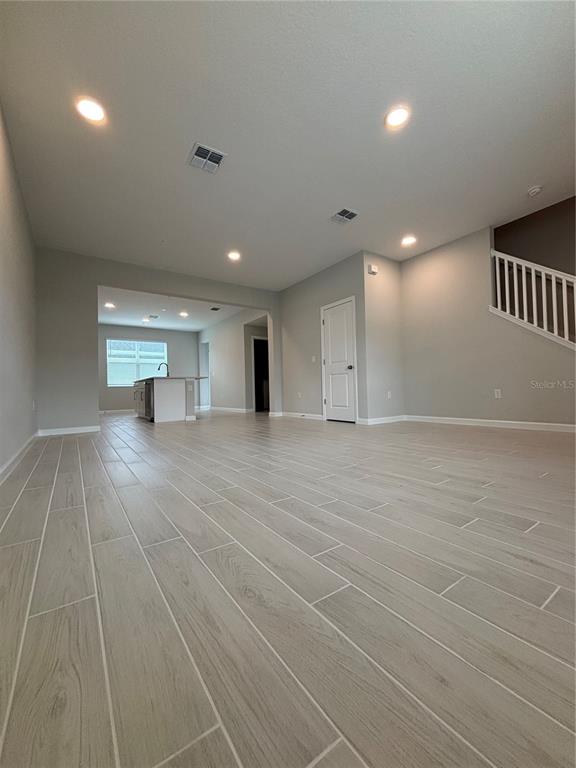 660 Pothos Street Apopka, FL 32703 - Photo 5 of 32 a view of empty room with wooden floor