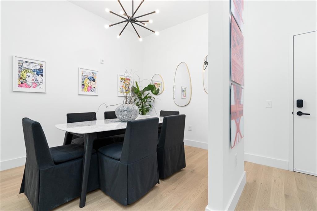 567 Ponce De Leon Avenue Northeast, Unit 516 Atlanta, GA 30308 - Photo 11 of 45 a view of a dining room with furniture