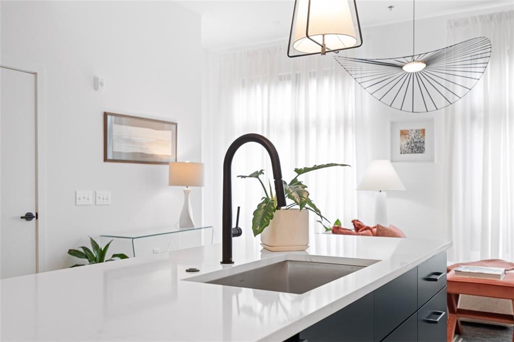 567 Ponce De Leon Avenue Northeast, Unit 516 Atlanta, GA 30308 - Photo 29 of 45 a kitchen with a sink and a refrigerator