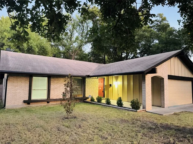 a backyard of a house with barbeque oven