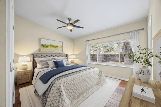 a spacious bedroom with a large bed and a window