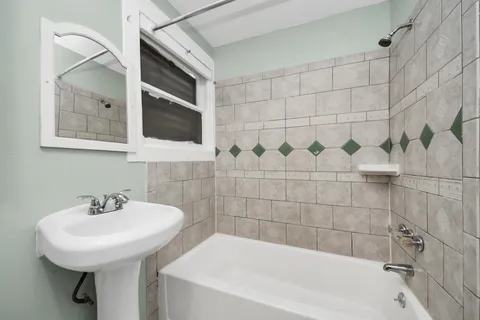 a bathroom with a sink and a bathtub