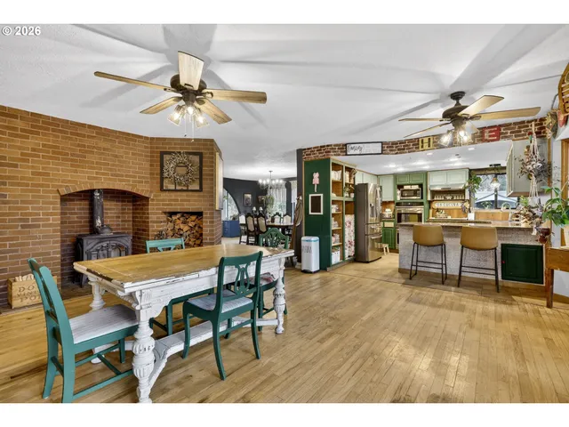 a view of a dining room with furniture and a chandelier