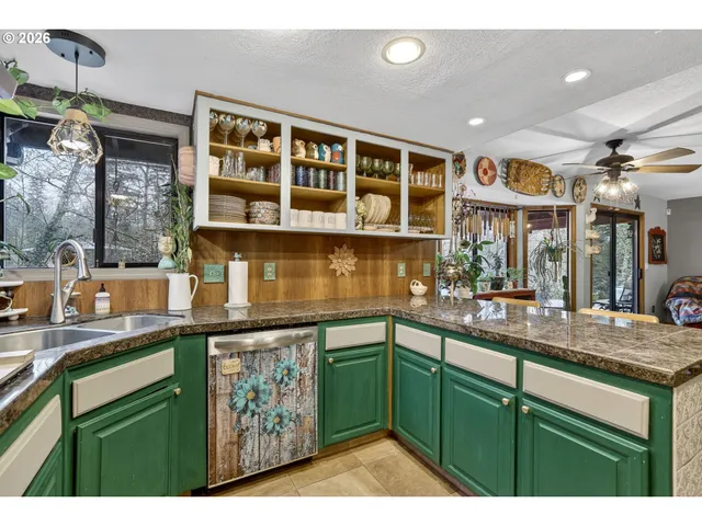 a kitchen with a sink and cabinets
