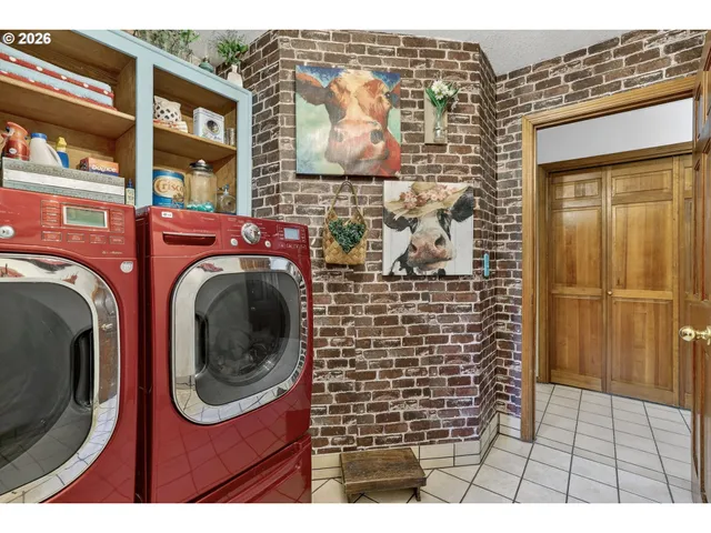 a backyard of a house with a garden and outdoor seating