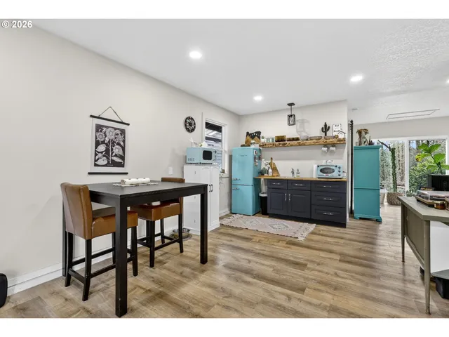 a living room with furniture fireplace and a large window