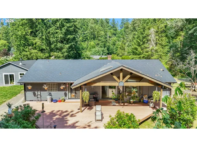 a view of outdoor space with wooden floor and windows