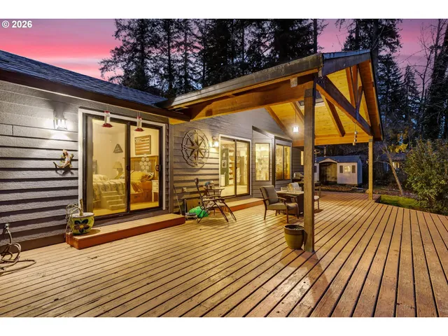 a view of a house with a fountain in the background