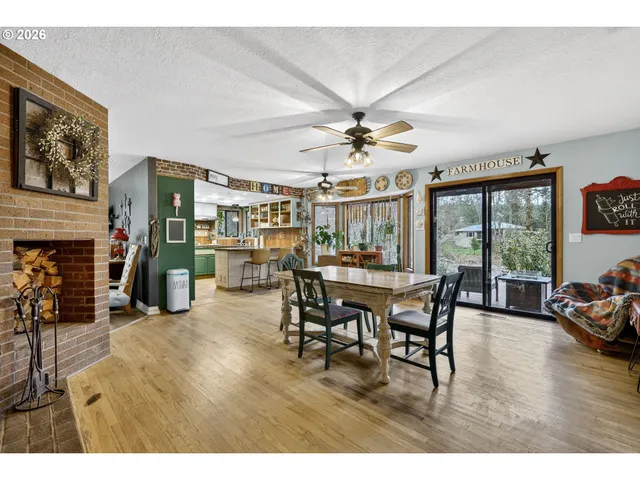a dining room with furniture and wooden floor